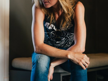 Woman Leans On Legs