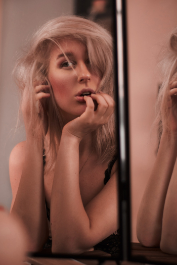Woman Looking at Mirror Woman Looking at Mirror