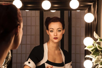 woman looking at mirror woman looking at mirror