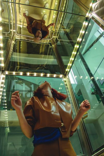 woman looking at mirror woman looking at mirror