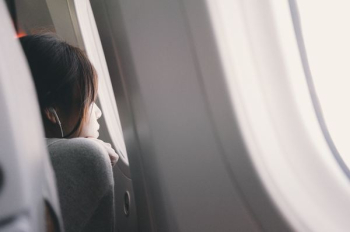 woman looking plane mirror woman looking plane mirror