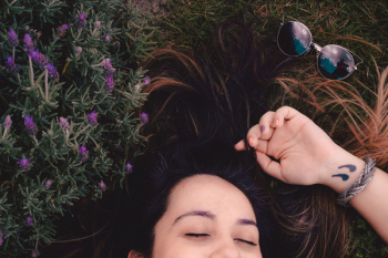 Woman Lying on Flower Field Woman Lying on Flower Field