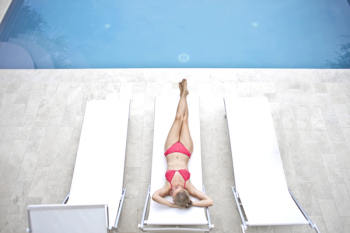Woman Lying on White Sun Lounger Woman Lying on White Sun Lounger