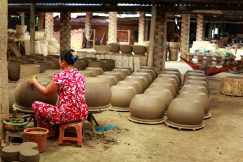Woman Making Pots Woman Making Pots