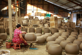 Woman Making Pots Woman Making Pots