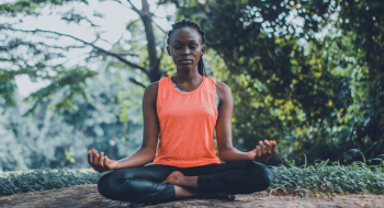 Woman Meditating in the Outdoors Woman Meditating in the Outdoors