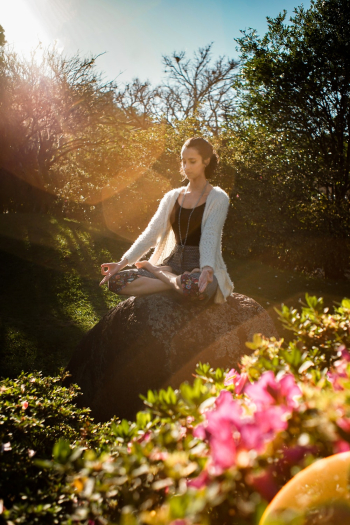Woman Meditating on Rock Woman Meditating on Rock