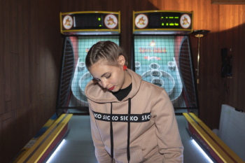 Woman Near Maze Arcade Machine Woman Near Maze Arcade Machine