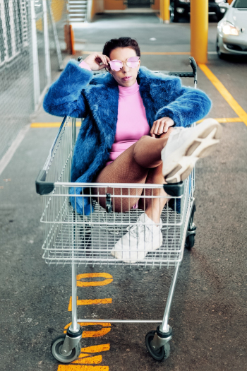Woman On Shopping Cart Woman On Shopping Cart