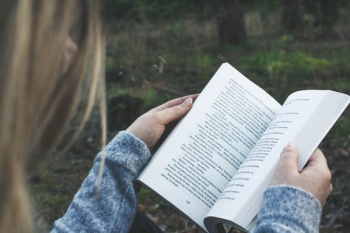 woman opening book woman opening book