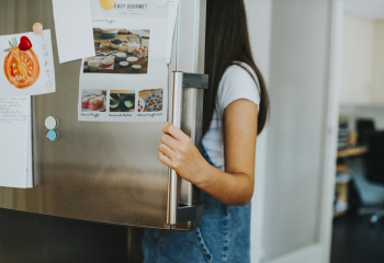 Woman Opening Refrigerator Woman Opening Refrigerator