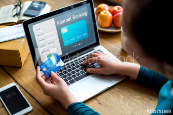 Woman paying online via a credit card