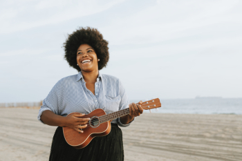 Woman Playing Ukulele Woman Playing Ukulele
