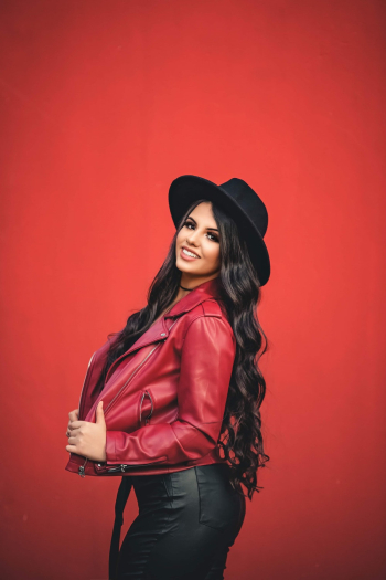 Woman Poses Wearing A Red Jacket Woman Poses Wearing A Red Jacket