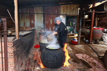 Woman Pouring Water on Bowl