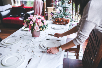 Woman Preparing Christmas Table Woman Preparing Christmas Table