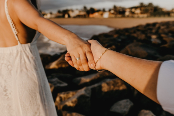 Woman Reaching Hand of Another Person