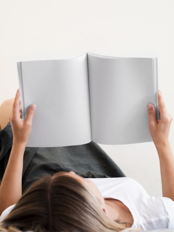 Woman reading a mock-up magazine Free Photo