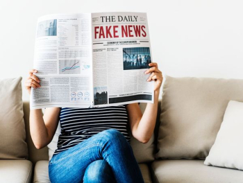 woman reading newspaper woman reading newspaper