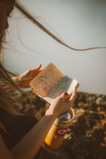 woman reading notebook woman reading notebook