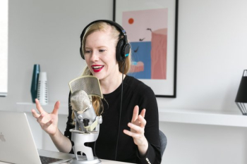 Woman Recording Podcast At Mic Woman Recording Podcast At Mic