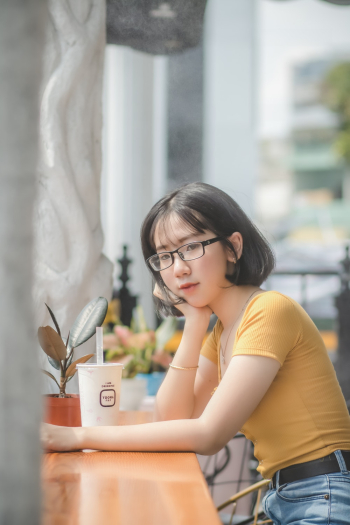 Woman Resting Head on Right Hand Leaning O Table Woman Resting Head on Right Hand Leaning O Table