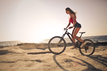 Woman Riding A Mountain Bike Woman Riding A Mountain Bike