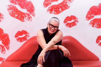Woman Sat On Red Lip Couch Woman Sat On Red Lip Couch