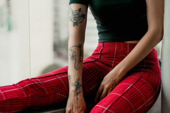Woman Showing Her Tattoos Woman Showing Her Tattoos