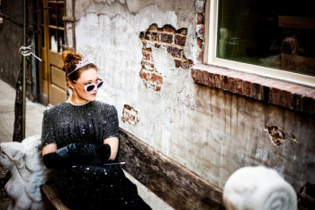 woman sit on bench facing on concrete wall woman sit on bench facing on concrete wall