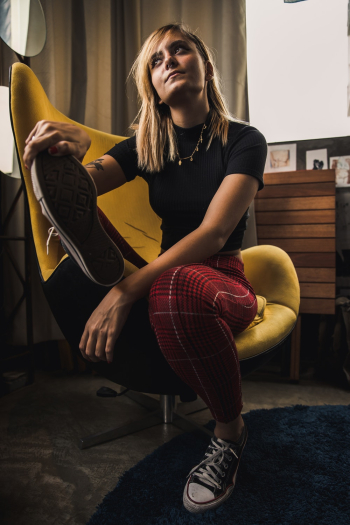 Woman Sits on Accent Chair Woman Sits on Accent Chair