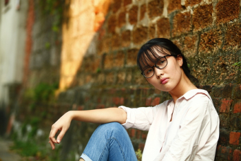 Woman Sitting Against Wall Woman Sitting Against Wall