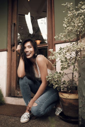 woman sitting beside glass door woman sitting beside glass door