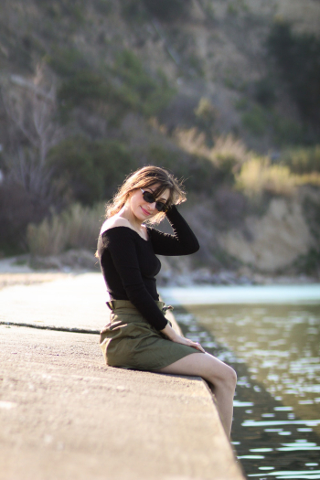 Woman Sitting Beside Water