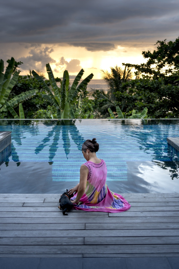 Woman Sitting Facing Pool Woman Sitting Facing Pool