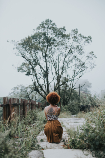 Woman Sitting in Front of a Tree Woman Sitting in Front of a Tree