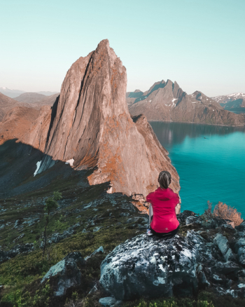 Woman Sitting in Front of Mountain Woman Sitting in Front of Mountain
