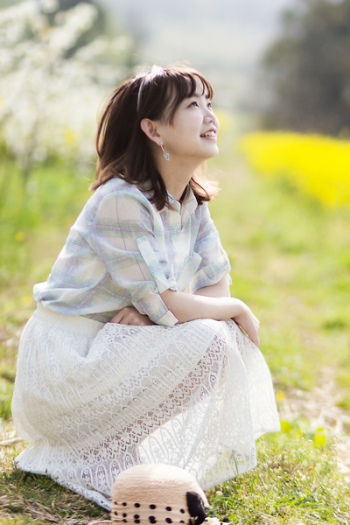Woman Sitting Near Grass