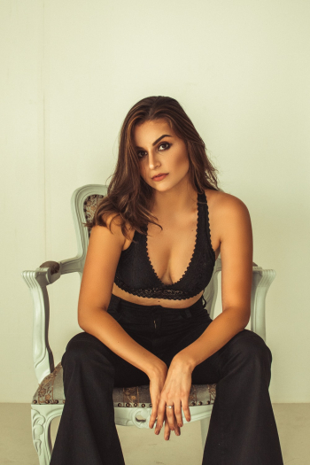Woman Sitting on Armchair Woman Sitting on Armchair
