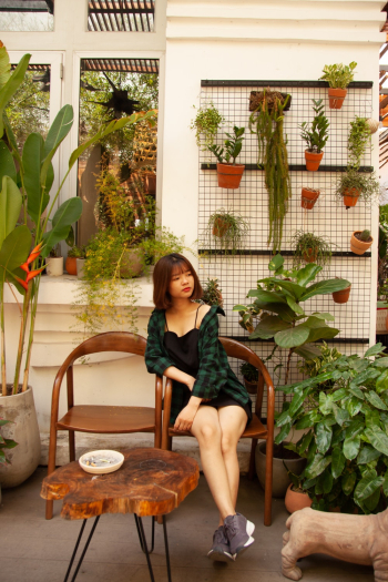 Woman Sitting On Armchair Woman Sitting On Armchair