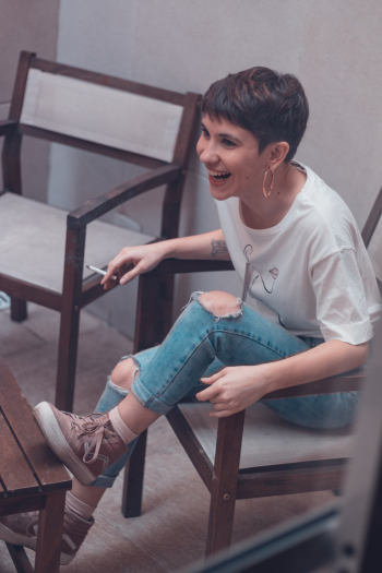 Woman Sitting on Armchair Woman Sitting on Armchair