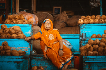Woman Sitting on Containers Woman Sitting on Containers
