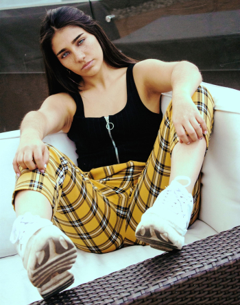 Woman Sitting on Couch Woman Sitting on Couch