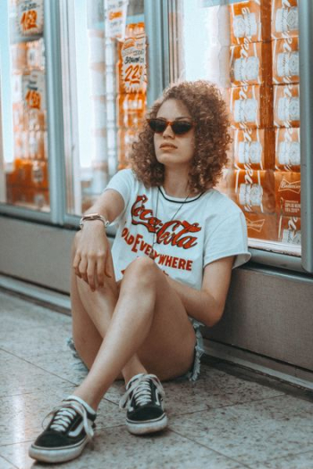 woman sitting on floor with two knees up