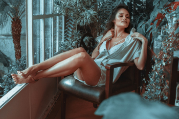 Woman Sitting on Leather Padded Armchair Woman Sitting on Leather Padded Armchair