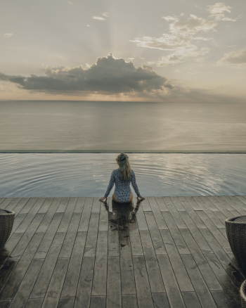 Woman Sitting on Poolside