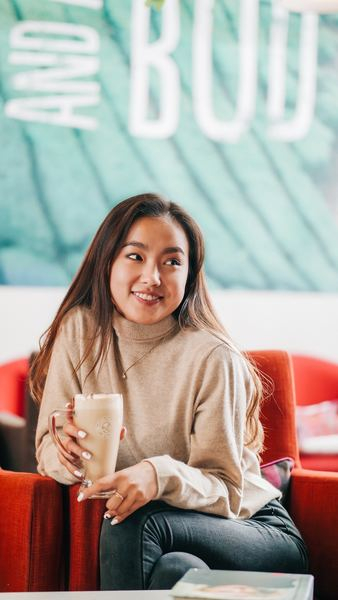 woman sitting on red chair