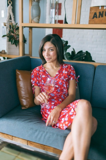 Woman Sitting on Sofa Holding Wine Glass Woman Sitting on Sofa Holding Wine Glass