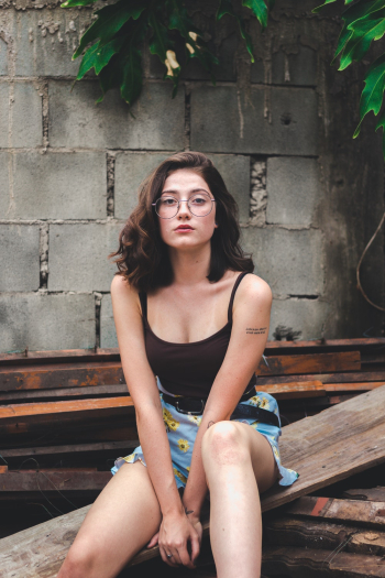 Woman Sitting on Wood Plank Woman Sitting on Wood Plank