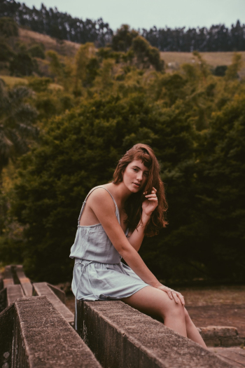 Woman Sitting Outdoors Woman Sitting Outdoors